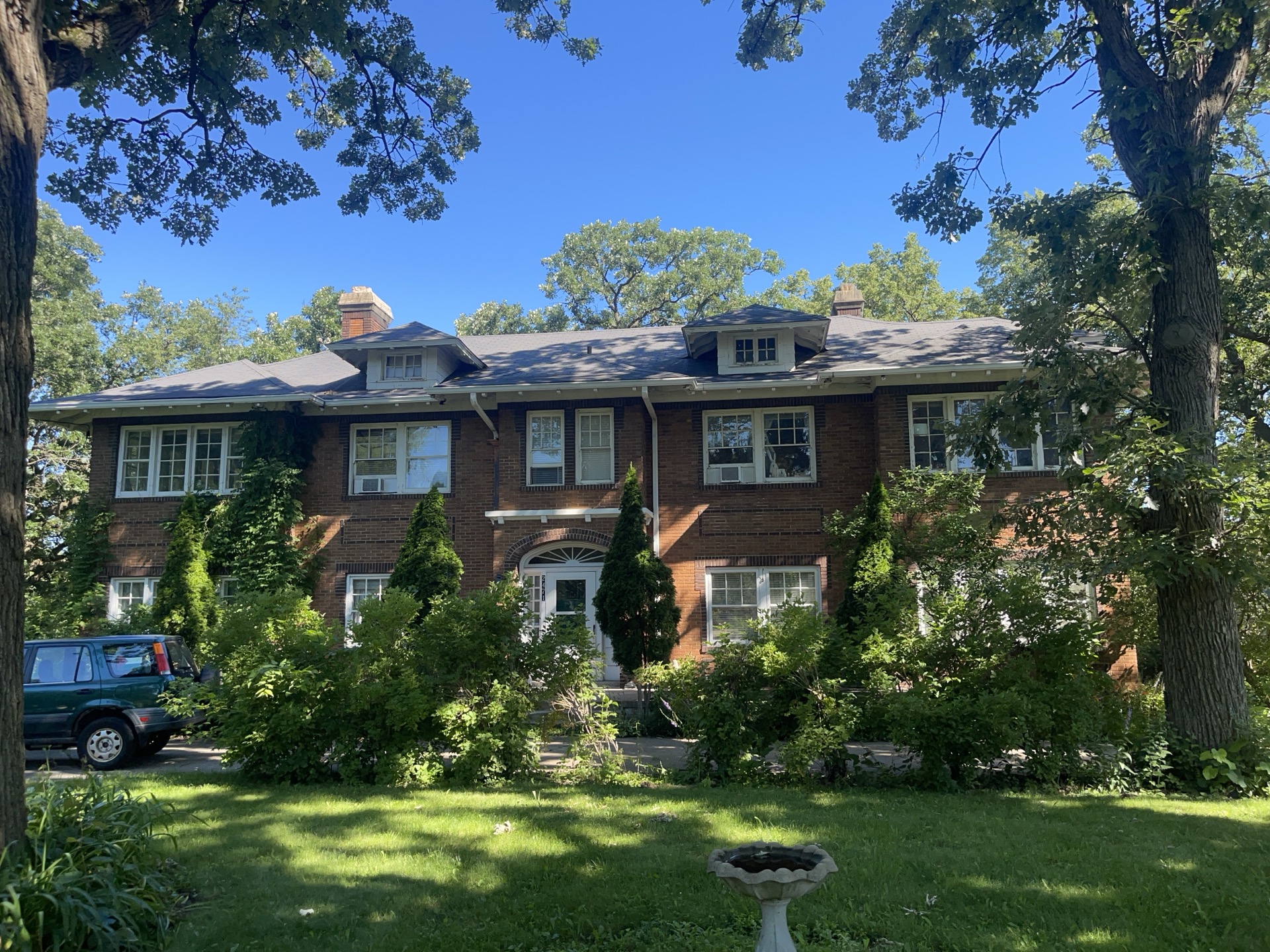 Brick estate with new shingle roof