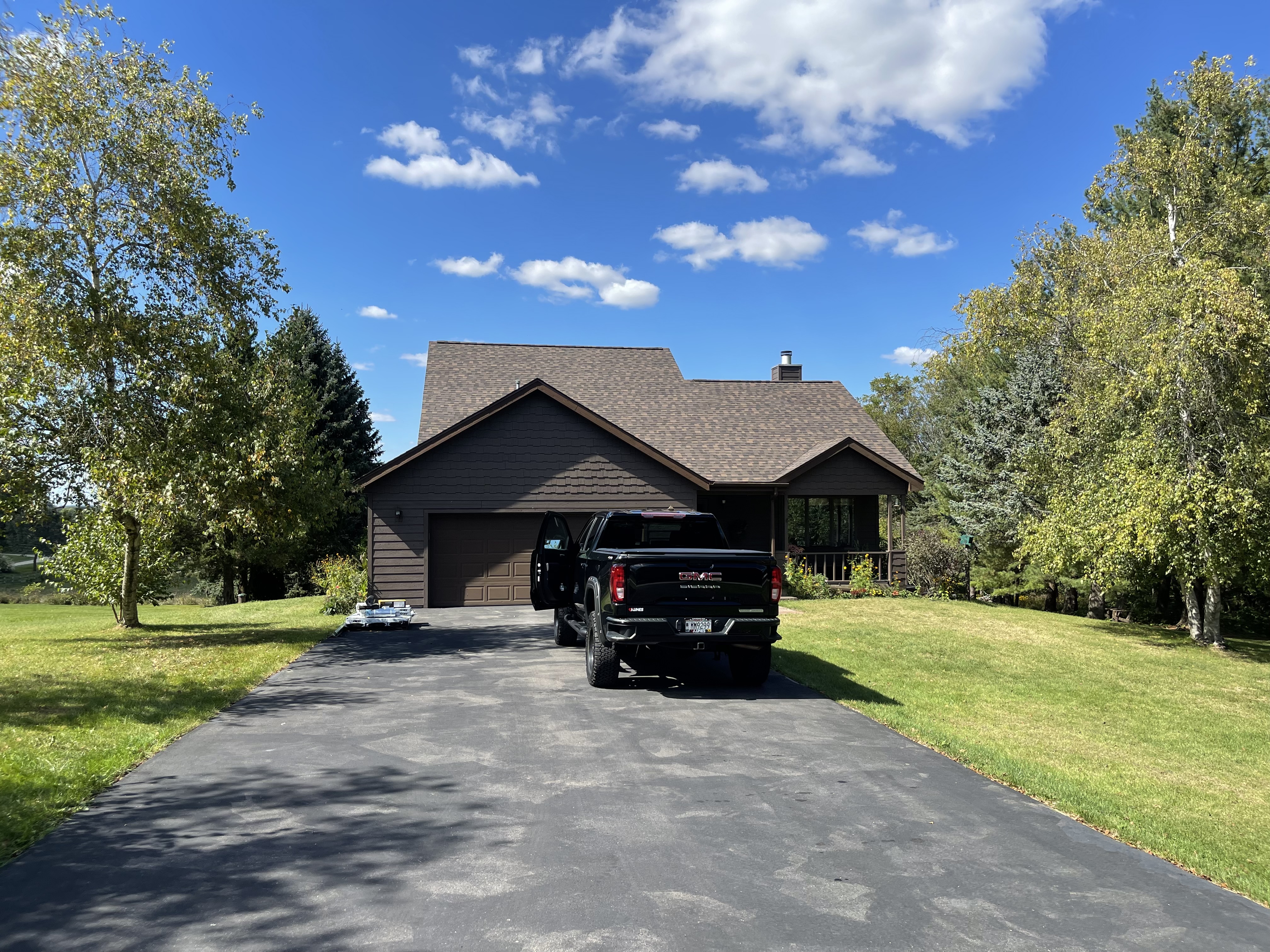 Black ranch home with finished roof